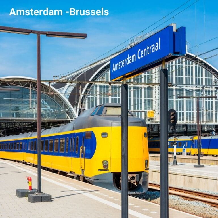 A train at Amsterdam Central Station, ready for departure, showcasing the station's architectural beauty and the efficiency of European rail travel.