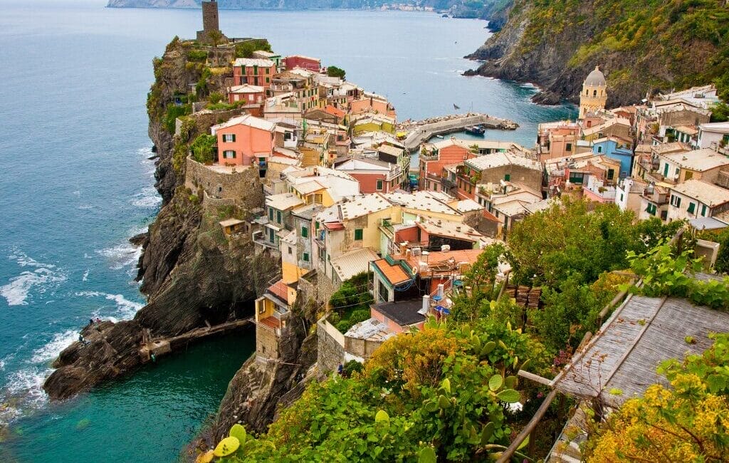 A vibrant village in Cinque Terre perched on cliffs above the Mediterranean Sea