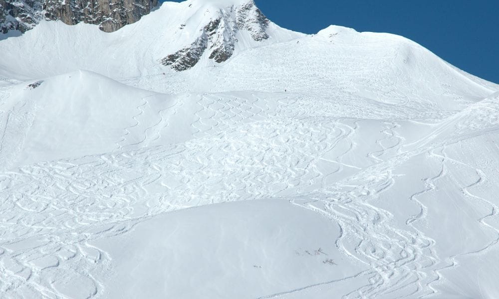Snow-covered Alps, representing the serene beauty of Lech-Zürs, a premier ski destination in Austria.