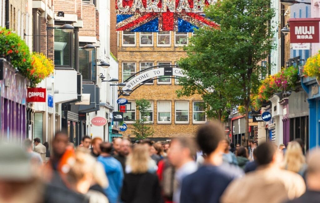 LGBTQ community celebrating in the vibrant streets of London's Soho, showcasing the city's inclusive spirit.