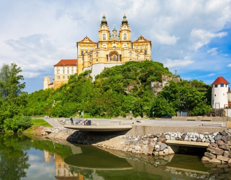 View of Melk Abbey's exterior with the river below