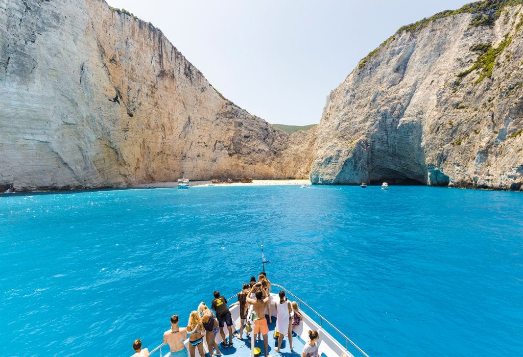 People on a boat heading to Navagio Beach, Zakynthos, Greece