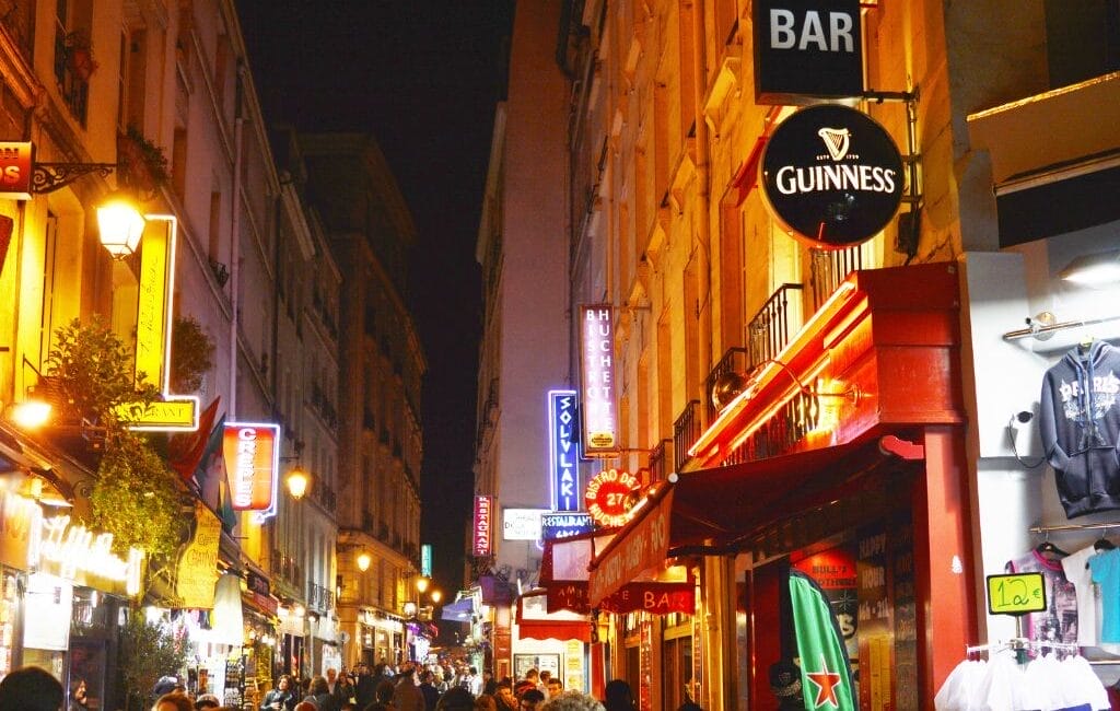 "LGBTQ community celebrating in the vibrant streets of Le Marais, Paris, showcasing the city's inclusive and diverse spirit.
