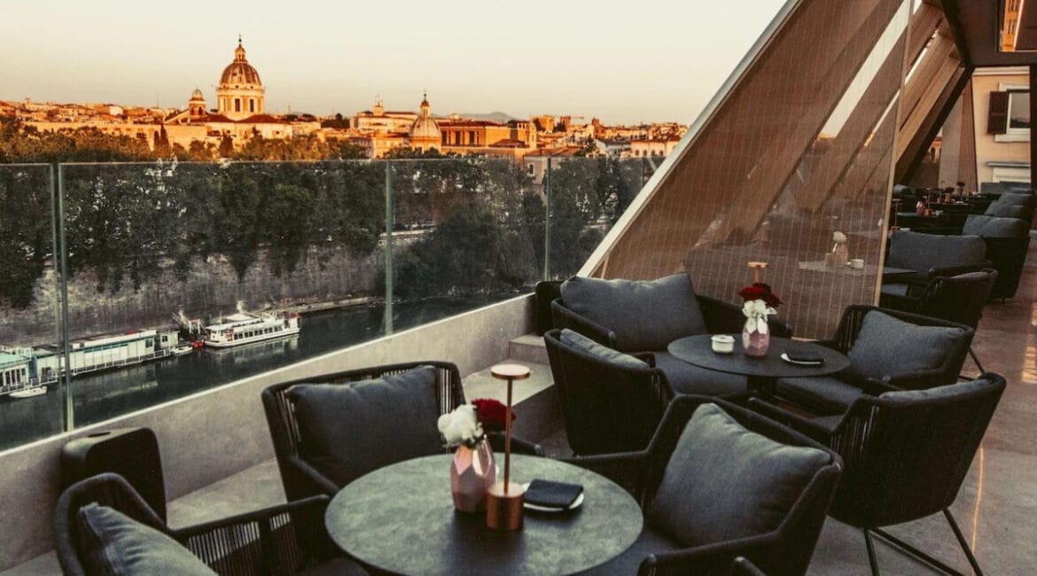 Terrace of The First Musica hotel with a view of Rome at night