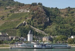 View of the Rhein River with picturesque landscapes and historic cities along the riverbanks.