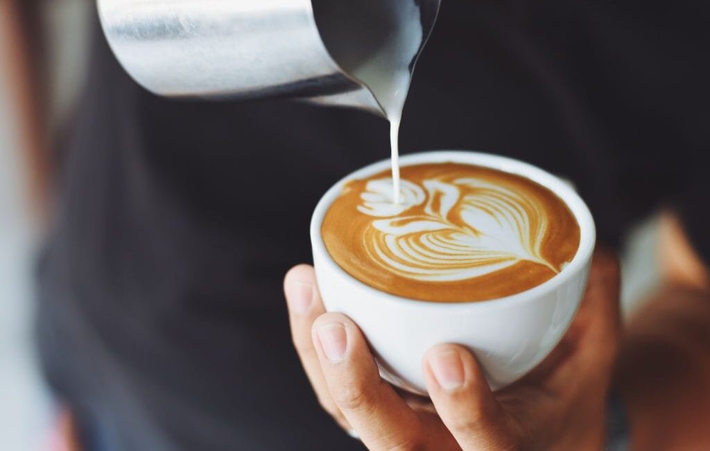 A steaming cup of coffee in a traditional Viennese café, representing the rich coffee culture in Vienna.