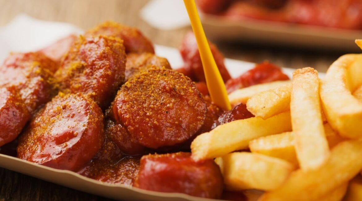 Authentic German currywurst with sausages and curry ketchup sauce